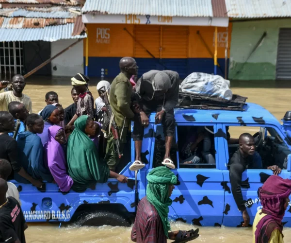 Residents wade through floodwaters in Maiduguri, northeast Nigeria, following heavy rainfall in September, 2024. Photo: Audu Marte/AFP via Getty Images